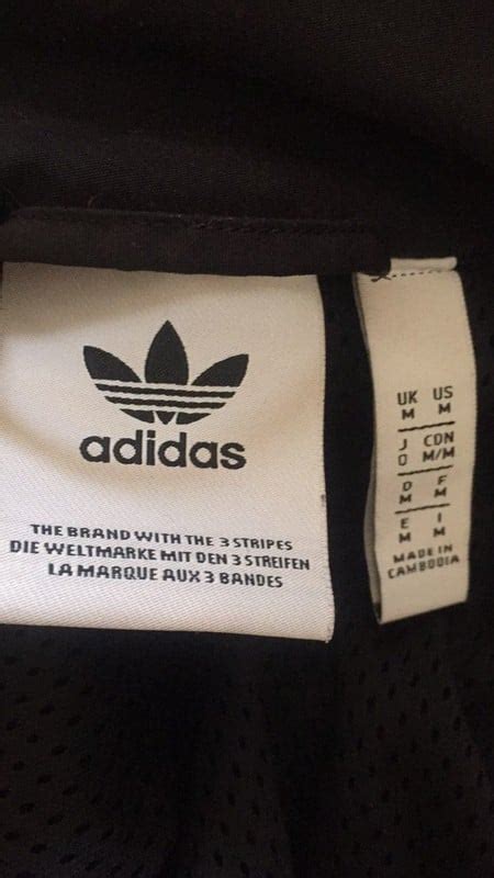 how to tell if adidas jacket are fake|adidas jacket detachable label.